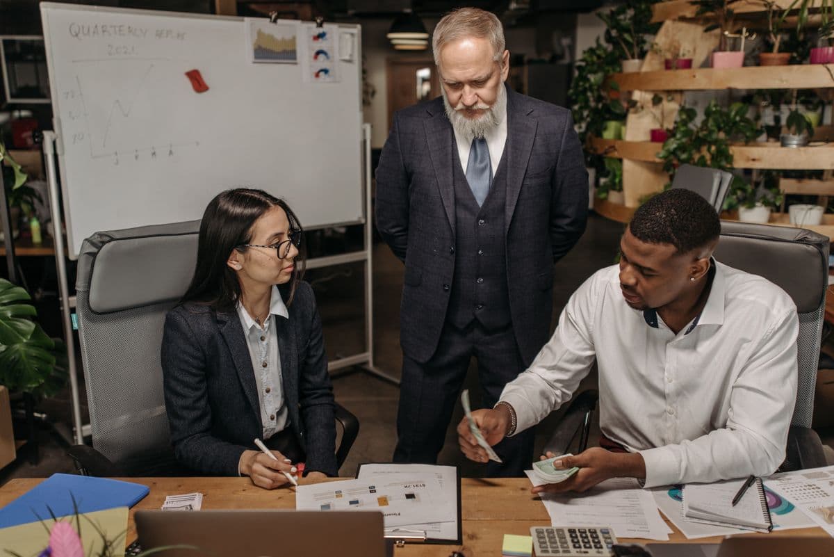 Leaders reviewing the cost of technology leadership